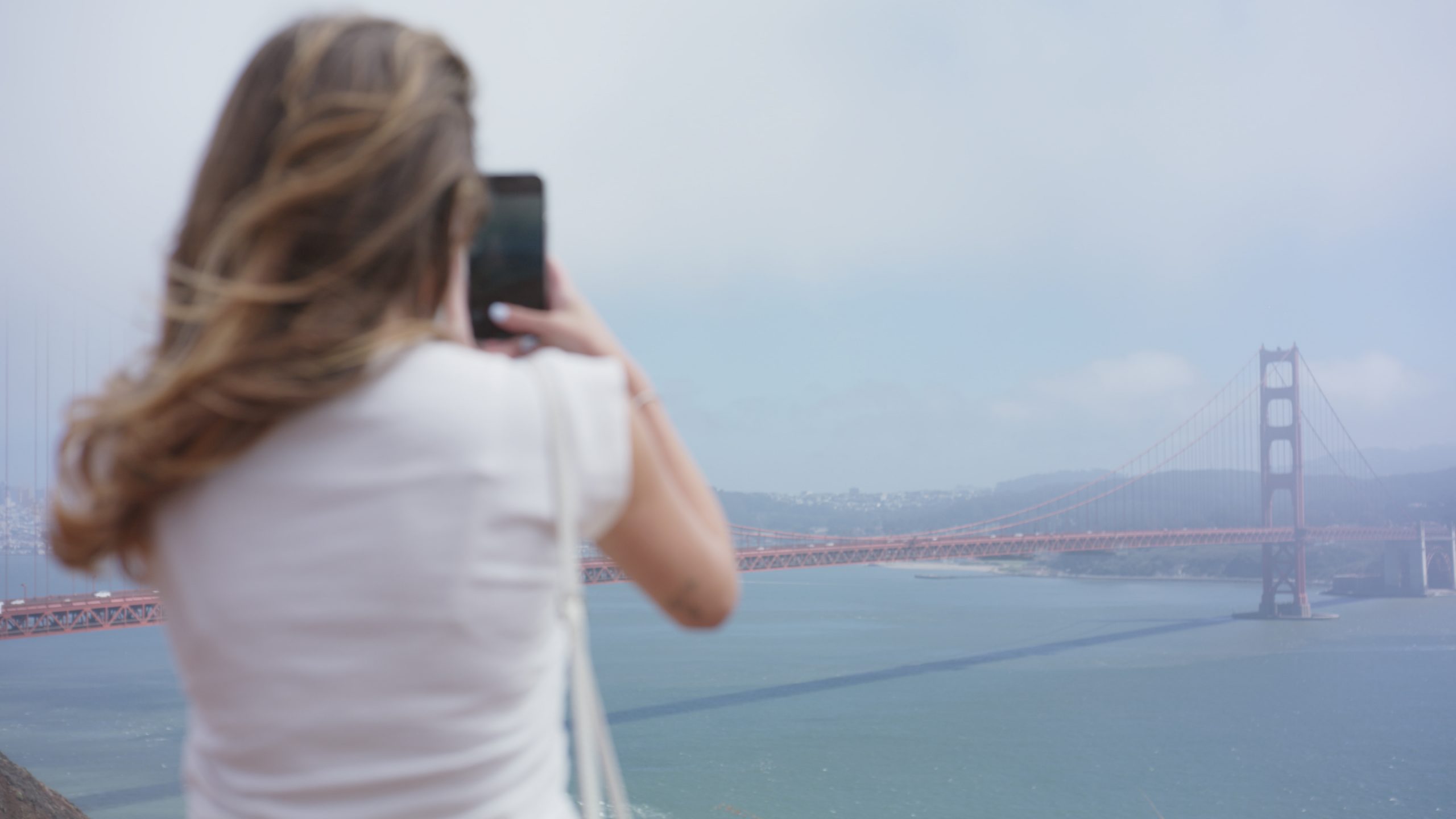 Flo taking pic of Golden Gate scaled